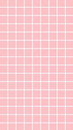 a pink tiled wall with white squares on the top and bottom, as well as an orange stripe