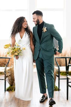 a bride and groom smile at each other