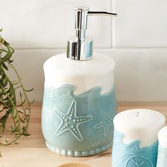 a soap dispenser with starfish designs on it