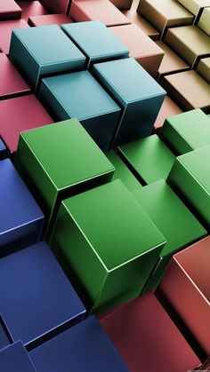 many different colored boxes are stacked on top of each other in order to create an interesting pattern