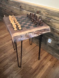 a wooden table with some chess pieces on it