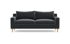 a black couch with two pillows on it's back and one arm facing the camera