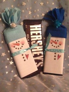 two wrapped candy bars with snowmen on them