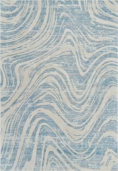 a blue and white rug with wavy lines on it