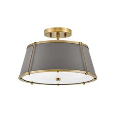 a light fixture with a grey shade on the top and a gold trim around it