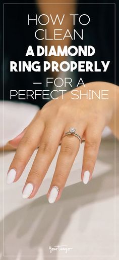 a woman's hand with white nail polish on it and the words how to clean a diamond ring properly for a perfect shine