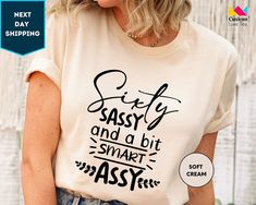 a woman wearing a t - shirt that says sassy and a bit smart assy