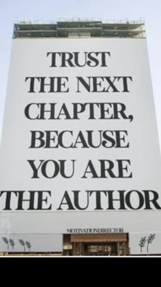 a large white sign that says trust the next charter, because you are the author