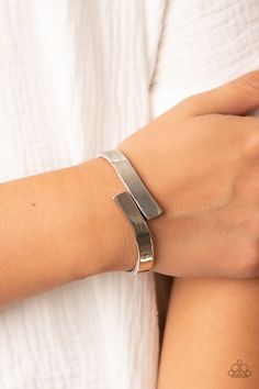 Two oversized silver ribbons delicately overlap across the center of the wrist, creating a stylish and stackable bangle-like cuff. Features a hinged closure. Sold as one individual bracelet. Cat Eye Jewelry, Gray Bracelet, Orange Bracelet, Yellow Bracelet, Stackable Bangles, Brown Bracelet, Purple Bracelet, Mixed Metal Jewelry, Printed Jewelry