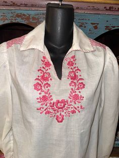 Rare vintage blouse with pink embroidery. measurements in photos. one tiny stain on lower back (i have not tried to remove). Bohemian Long Sleeve Tops With Machine Embroidery, Pink Cotton Tops With Intricate Embroidery, Pink Folk Style Tops With Floral Embroidery, Folk Style Pink Top With Floral Embroidery, Folk Style Pink Blouse With Floral Embroidery, Pink Folk Style Top With Floral Embroidery, Pink Folk Blouse With Floral Embroidery, Fitted Long Sleeve Vintage Embroidered Top, Spring Blouse With Intricate Embroidery In Pink