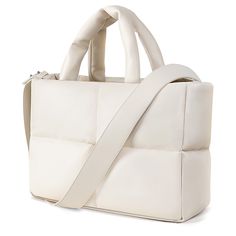 a white handbag on a white background with strap around the top and bottom part