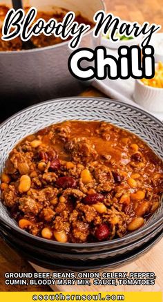 a bowl filled with chili and beans on top of a table