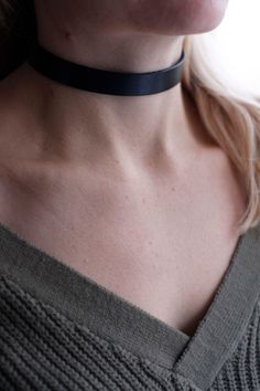 Genuine black Veg Tan leather choker/collar. Can also be worn as wrap around bracelet. Made from 1.8 mm thick and 15 mm width leather. Secured with snap buttons. If you can not find your size, please write it in a comment section when placing your order and I'll make it to fit your neck. How to measure your neck: If you don't have a seamstress tape measure, take a piece of yarn or string and wrap that around your neck to a comfortable fit marking the point where the end touches itself. Lay the s Edgy Leather Choker Jewelry, Adjustable Leather Trendy Choker, Edgy Leather Choker, Adjustable Edgy Leather Choker, Black Leather Choker Gift, Adjustable Black Choker, Adjustable Black Band Choker, Black Choker With Black Band, Black Band Choker Jewelry