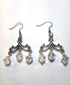 Chandelier earrings with large clear crystals.  Great for a fancy dinner or go Bohemian. Look for a swinging time. Crystal Chandelier Earrings For Party, Crystal Dangle Chandelier Earrings, Crystal Dangle Chandelier Earrings For Pierced Ears, Silver Crystal Chandelier Earrings For Pierced Ears, Silver Chandelier Earrings With Dangling Beads For Party, Silver Crystal Dangle Chandelier Earrings, Silver Crystal Chandelier Earrings With Dangling Beads, Elegant Nickel-free Clear Crystal Earrings, Silver Crystal Earrings With Dangling Beads For Wedding