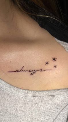 a woman with a tattoo on her shoulder that says, alwayss and stars are in the sky