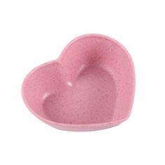 a pink heart shaped bowl on a white background