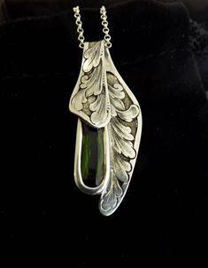 Hand Engraved Silver and Green Tourmaline Pendant Ornate Carved Sterling Silver Jewelry, Art Nouveau Silver Gemstone Jewelry, Silver Gemstone Jewelry In Art Nouveau Style, Art Nouveau Engraved Pendant Jewelry, Nature-inspired Carved Sterling Silver Jewelry, Hallmarked Silver Tourmaline Jewelry, Tourmaline Pendant, Silver Engraving, Green Tourmaline