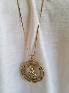 "The Age of Aquarius was in the late 1960's were this type of jewelry was in style. Also the time of the hippies and Mods, Beatles were starting out. The company Celebrity started out in New York City but never really got famous but they created this pendant which depicts the Aries Sign of A Ram. This unique pendant came from a Vintage Shop in Northglenn, Co. The chain does have some wear towards the clasp but the pendant is in great condition. This pendant necklace will arrive in a gift box wit Retro Gold Nickel-free Jewelry, Retro Nickel-free Gold Jewelry, Symbolic Vintage Medallion Jewelry With Charm, Retro Collectible Pendant Jewelry, Collectible Retro Pendant Jewelry, Symbolic Zodiac Sign Collectible Jewelry, Symbolic Zodiac Sign Jewelry, Round Zodiac Sign Jewelry Collectible, Collectible Round Zodiac Sign Jewelry