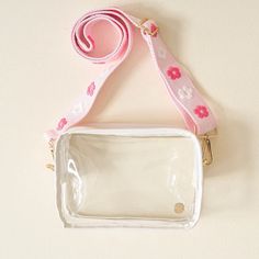 Your new BFF for game day, concerts, festivals, and everyday! Featuring an adjustable embroidered strap with beautiful floral details, this clear structured bag has double hooks on either end. Make a statement and carry everything you need in this darling clear crossbody bag! 7.75" L x 6" H Strap Length 26-49" Gold Hardware Details Adjustable strap with hooks Sized to fit stadium guidelines White Crossbody Bag With Clear Strap, White Crossbody Shoulder Bag With Clear Strap, Clear Bag With Clear Strap For Spring, Clear Crossbody Shoulder Bag With Zipper, Clear Crossbody Shoulder Bag With Zipper Closure, Clear Bags With Clear Strap For Spring, Spring Clear Bag With Clear Strap, Trendy Clear Bag With Adjustable Strap, Clear Crossbody Bag With Adjustable Strap