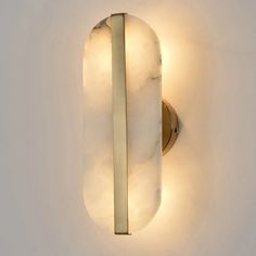 a light that is on the side of a wall with some lights around it and a white background