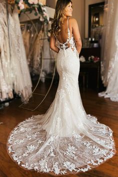 a woman in a wedding dress looking back