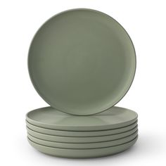 a stack of green plates sitting on top of each other