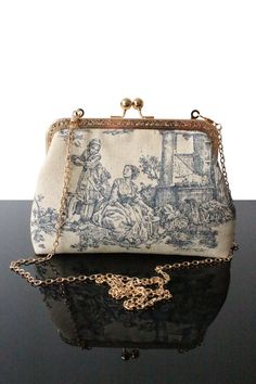 "Ideal Toile de jouy bag for Wedding day or Evening bag, in addition to be elegant, original and comfortable, this bag makes you unique. Indeed every bags in our collection are unique, everyone can have a high know how and original design bag. We always exploring new designs and details to offer the best quality as well as a large offer of bags in terms of your wishes (height, color, texture). These bags you will be essentials to put different objects and accessories. Our collection of Toile de Vintage Blue Bag For Wedding, Vintage Blue Bags For Wedding, Linen Handbags, Wedding Clutch Purse, Bag For Wedding, Spring Purses, Dream Bags, Design Bag, Women Purse