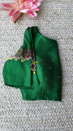 Hand embroidered ready made saree blouse / crop top/stitched saree blouse usa / green checks saree blouse/ hand embroidered blouse/zardosi blouse/green saree high neck blouse/dark red pure silk blouse/green maggam work blouse        It is very true that a perfect blouse is the one which makes your saree look stand out !! If you find one of such a style that you have been wanting to have then dont let it go !! we carry such unique trending blouses that instantly add a stylish look to any saree !!     Well..!! we understand that you may not get in your desired size/pattern, here you go with customization according to your size/pattern which we can deliver in 1-2 weeks of time period !!      Here is a beautiful Hand embroidered saree blouse in green color that has simple jewel inspired embroi Fitted Green Choli With Floral Embroidery, Festive Green Embroidered Fitted Top, Festive Fitted Green Embroidered Top, Fitted Green Embroidered Top For Festive Occasions, Festive Green Fitted Embroidered Top, Green Floral Embroidered Raw Silk Traditional Wear, Green Raw Silk Traditional Wear With Floral Embroidery, Green Tops With Resham Embroidery For Wedding, Festive Green Embroidered Top With Resham Embroidery