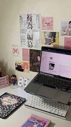 an open laptop computer sitting on top of a white desk