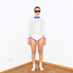 Vintage Y2K gymnastics bodysuit in white   Size on tag : , Approx. size : M, Length : 61 cm / 24", Armpit to armpit : 36 cm / 14.5". Material : Nylon, Lycra. Lining : -.    Model Height : 168 cm / 5'6". White Fitted Long Sleeve Bodysuit, Sporty Long Sleeve White Swimwear, White Stretch Long Sleeve Swimwear, White Fitted Bodysuit For Sports, White Long Sleeve Stretch Swimwear, White Fitted Sporty Swimwear, Sporty Fitted White Swimwear, White Stretch Sporty Bodysuit, White Sporty Bodysuit For Summer