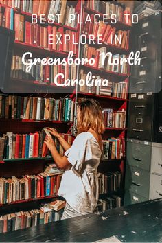 a woman standing in front of a book shelf filled with books