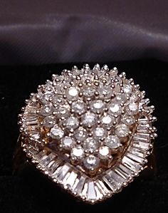 "This ring is gorgeous! It is from an Estate in New York City. The owner was an actress in the New York Theatre, and loved large diamond rings. This definitely fits the bill! It is a \"Ballerina\" design ring. The description of a Ballerina ring is \"fanciful and a distinctive style of gems\" in this case Diamonds! The cluster of Diamonds in the center simulates the flowing movement of a Ballerina dancing, and creates a swirling effect of Diamonds on the finger. Baguettes are usually used in thi Yellow Gold Cluster Diamond Ring For Anniversary, Yellow Gold Diamond Cluster Ring For Anniversary, Anniversary Yellow Gold Cluster Diamond Ring, 14k Gold Cluster Diamond Cut Wedding Rings, Yellow Gold Cluster Ring With Diamond Cut, 14k Gold Pear-shaped Diamond White Ring, Dazzling Pear-shaped Diamond Promise Ring, Pear-shaped Diamond Cluster Wedding Ring, Anniversary Cluster Ring With Baguette Cut And Halo Setting