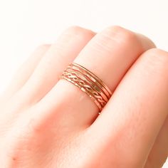 * For your comfort we recommend going up 1/2 size if you are planning on wearing 5 or more rings on one finger. * Set of 5 14K rose gold filled stackable rings. * Made out of 14K rose gold filled 18 gauge round wire (approx. 1 mm wide before texturing). * Our jewelry is packaged in a cute box ready for gift giving. You can also request a personal message which we hand write onto a gift tag. We try to package responsibly in an effort not to waste. Often more than one item with be placed in the sa 14k Rose Gold Stackable Promise Rings, Delicate Stackable 14k Rose Gold Rings, Rose Gold Stackable Midi Promise Rings, Delicate Rose Gold Stackable Rings With Round Band, 14k Rose Gold Midi Rings With Round Band, 14k Rose Gold Stackable Rings, Delicate 14k Rose Gold Rings, Stackable 14k Rose Gold Rings, Delicate Rose Gold Stackable Promise Rings