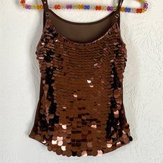 Brand New, Never Wear Before, Eye Catching Large Brown Sequins In The Front And Small Beads Around Edges, Knit Fabric With Adjustable Shoulder Stripes. Can Be Wear Along Or With Jacket, Cardigan Or Scarves! Pets Free And Smoke Free Home, Buy Two Get 20% Off! Measurement: From Right To Left Armpits Can Stretch From 18 1/2” To 21”. Back Body 14” L. With Adjustable Spaghetti Strips. The Fabric Is Stretchy Knit. Brown Sleeveless Top For Party, Brown Sleeveless Party Top, Brown Camisole Top For Party, Brown Camisole Tops For Night Out, Brown Fitted Tank Top For Party, Fitted Brown Tank Top For Party, Jacket Cardigan, Small Beads, Net Fabric