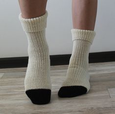 Hand knit socks Merino wool socks Hand knitted socks Cozy socks for gift Handmade socks for women Wool socks are warm, and cozy. Knitted socks can be a gift for a loved one, for friends, or loved ones! These handmade socks are sized to fit an adult woman or teenager. Wool socks Eu size 37 - 39 length - 74 cm (29.13 inches) Hand knit socks in white merino wool and black alpaca wool Care wool socks: Handmade socks can be washed by hands or in the machine. When machine-washing, always turn your knitted socks inside out before adding to your machine (this will help prevent pilling), and always go for the cool (go no hotter than 30oC), wool-wash setting. Knitted socks let it dry on a flat surface. Wool socks do not bleach. Please note that a slight color difference should be acceptable due to t Cozy Handmade Socks For Stocking Stuffers, Women Wool Socks, Black Alpaca, Womens Wool Socks, Merino Wool Socks, Handmade Socks, Hand Knit Socks, Knitted Socks, Handmade Gifts For Her