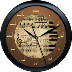 a clock with musical notes on it and numbers around the clock, as well as music staffs