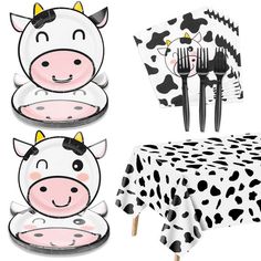 a cow themed tableware set with black and white polka dot plates, forks and napkins