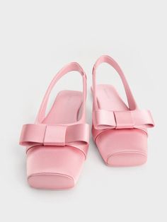 In contrast to their delicate pink finish, these ballet flats feature boxy, structured bows paired with matching square toes for a contemporary twist. Perfect for embracing the ever-popular coquette trend, they also feature slingback straps for easy wear and added comfort. Satin Bow, Easy Wear, Ballet Flats, Ballet, Twist, Satin, Square, Pink