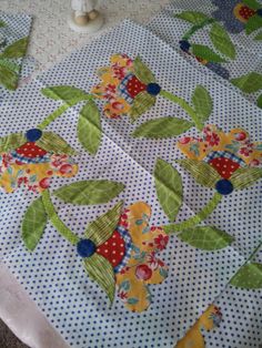 the table cloth has flowers and leaves on it