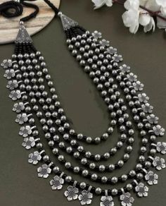 Multilayer Long Flower Bead Necklace Silver black Handmade Indian jewelry, Oxidized Necklace, Jewelry Set Gift for her Wedding necklace This bead necklace amplifies the elegance and beauty of Indian women. Choose this excellent piece of handmade Indian jewelry to make heads turn. Its adjustable length makes it easy to wear and can be paired with sarees or ethnic dresses. Made with premium quality material, you can rest assured of its quality. You can also select this piece as Navratri jewelry an Luxury Necklace For Ceremonial Navratri, Silver Multi-strand Necklace With Black Beads, Silver Long Beaded Necklace With Black Beads, Black Bohemian Necklace For Celebration, Traditional Black Multi-strand Jewelry, Black Flower-shaped Jewelry For Wedding, Black Flower-shaped Wedding Jewelry, Black Flower Shaped Wedding Jewelry, Silver Dangling Beads For Wedding