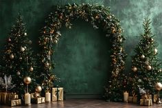 three christmas trees with presents under them in front of a green wall and wooden floor