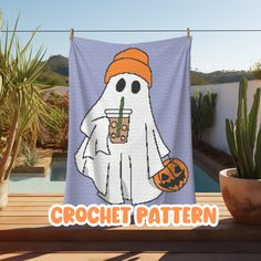 a towel that has a ghost holding a drink on it with the words crochet pattern