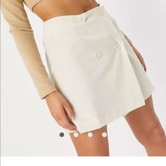 Button Skirt From Asos In A White/Cream Color. Never Worn With Tags Still On. Ecru Color. Chic Fitted Skort With Buttons, Chic Fitted Skort With Button Closure, High-waist Beige Skirt With Button Closure, High Waist Beige Skirt With Button Closure, White High Waist Skirt With Button Closure, High Waist White Skirt With Button Closure, Spring Short Skirt With Buttons, White Mini Skirt With Button Closure For Spring, Fitted Beige Mini Skirt With Buttons