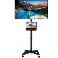 a computer monitor sitting on top of a black stand