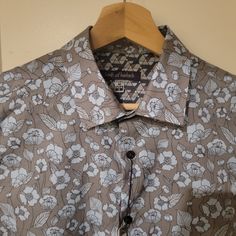 New With Tags. Light Blue Flowers On A Gray Background Formal Blue Floral Print Tops, Fitted Collared Gray Shirt, Fitted Gray Collared Shirt, Fleece Lined Flannel Shirt, Plaid Print Shirt, Lined Flannel Shirt, Patagonia Long Sleeve, Red And Black Flannel, Mens Sherpa