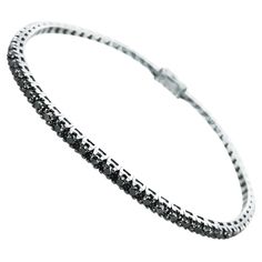 This 6.40 Carat Unisex Black Diamond Tennis Bracelet, is a stunning statement on either sex's wrist. Set in 18Kt Black Gold it stylishly dresses up day and night wear. The perfect gift for her! or yourself for the holidays. Timelessly beautiful it is also water proof and so never needs to be taken off. Worn alone or stacked with other bracelets, it screams style and beauty. Designed, produced and certified in Italy by Amin Luxury. Black Diamonds = 6.40 Cts Gold in Grams = 15.23 Grs Length of bra Chanel Set, Black Diamond Bracelet, Gold Tennis Bracelet, 18k Gold Bracelet, Bracelet Tennis, Modern Bracelets, Antique Bracelets, Gold Chanel, Diamond Tennis Bracelet