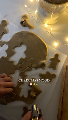 someone is making gingerbread cookies on the table