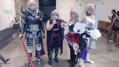 three women dressed in cosplay costumes standing next to each other