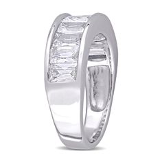 a white gold ring with three baguettes in the center and two rows of diamonds on