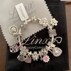 Linx Snake Chain Style Charm Bracelet In 925 Sterling Silver, With A Ball Clasp. Bracelet Is New With Tags And It Comes With 15 Unbranded Charms In Sterling Silver With Other Alloy Metals. Unbranded Charms Are A More Affordable Option For Customers Who, Like To Often Change Their Charms Out To Match Different Holidays, Themes, Outfits, Without Spending A Fortune. The Bracelet Itself Comes In Multiple Sizes, Which Can Be Selected At Check Out. All Items Are New And Will Arrive In A Velvet, Linx J Snake Chain Bracelets, Different Holidays, Clasp Bracelet, Jewelry Pouch, Snake Chain, Chain Styles, Silver Charms, Womens Jewelry Bracelets, Chain Bracelet